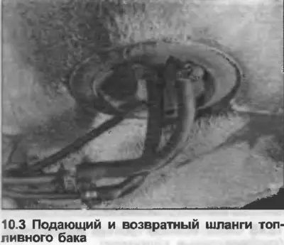 3. Place a container under the fuel tank. Loosen the clamps, disconnect the feed and return hoses…