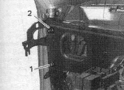 Unscrew bolt «1» and nut «2».