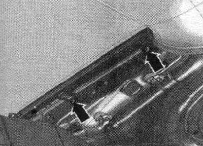 Remove the sunshade guide panel arrow bolts.