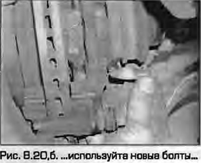 20. Pričvrstite nosač čeljusti na zglob upravljača koristeći nove vijke i pritegnite ih na navedeni…