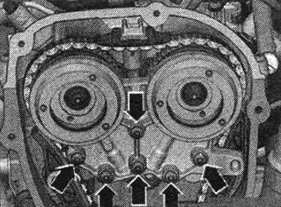 Unscrew the «arrow» bolts and remove the bearing housing.