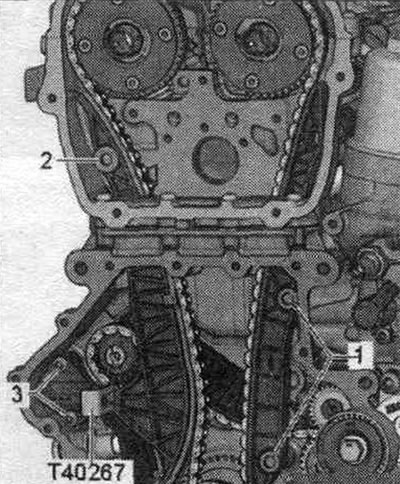 Remove the upper timing chain cover. Remove the lower chain drive cover. Remove the camshaft chain…
