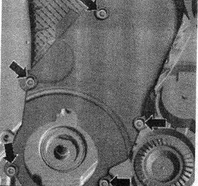 Unscrew the «arrow» bolts. Removing the lower timing belt cover.
