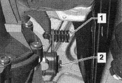 Unscrew bolts «1» and «2» and remove the mounting bracket.