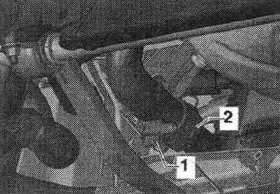 Place a pan under the engine and drain the coolant.