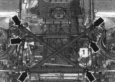 Never lower the vehicle onto its wheels unless the subframe support, steering gear, or subframe…