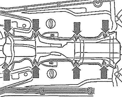 4.3. Unscrew the bolts and remove the protective shields under the propeller shaft (see arrows)