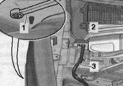 Разблакаваць фіксатары з аркі кола з дапамогай накидного ключа на 5,5 «паз. 1» і зняць кабельны…