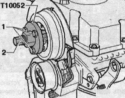 Nasaďte sťahovák «T10052» na náboj vačkového hriadeľa a zaskrutkujte skrutky «1» do náboja. Na…