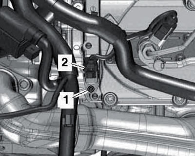 42.4b. Connector (2) and bolt (1) for fastening the sensor.