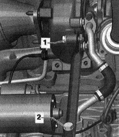Odskrutkujte skrutky «1» a «2», vyberte podperu turbodúchadla.