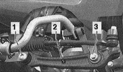 Odstráňte koleso. Odstráňte zvukovú izoláciu. Na vozidle so snímačom svetlej výšky odskrutkujte…